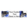 Black dog eye peering out of blue tinsel