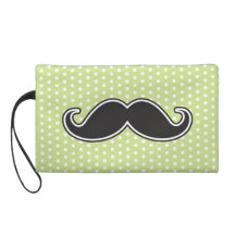 Black handlebar moustache on lime green polka dots wristlets