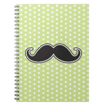 Black handlebar moustache on lime green polka dots notebooks
