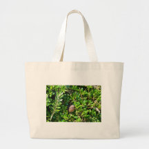 Blackbird in a laurel bush tote bag