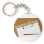 Blank paper on a clipboard keychains