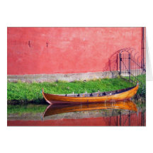 Boat-near-red-round-building BOAT CANOE WATER TRAN Greeting Cards