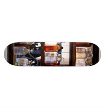 Bottles of Chemicals on Shelves Skate Board