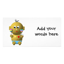 Bouncing baby boy with 2 rattles