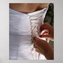 Bridesmaid hand lacing wedding dress photograph