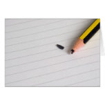 Broken pencil on writing pad cards