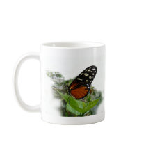 Butterfly on a plant in the garden , coffee mug