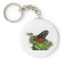 Butterfly on a plant in the garden , key chain