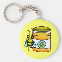 Cartoon bee leaning on honey jar keychains