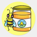 Cartoon bee leaning on honey jar sticker