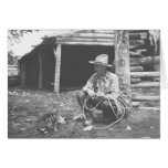 Cat eating out of a coffee can with a cowboy watch cards