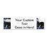 Cat in santa hat hiding in blue tinsel peering out bumper sticker