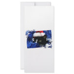 Cat staring out of blue Tinsel with santa hat