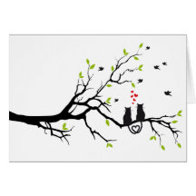 Cats in love with red hearts on spring tree card
