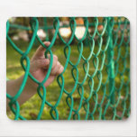 Child finger on fence mousepads