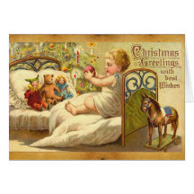 CHILD ON THE BED WITH TOYS AND CHRISTMAS GIFTS GREETING CARD