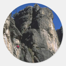 Climbing the vertical, Utah rock formation Round Stickers