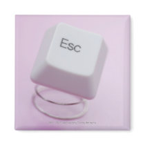 Close-up of an escape key fridge magnet