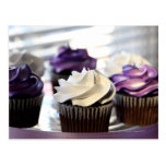 Close-up of cupcakes with selective focus on post card