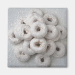 Close-up of powdered doughnuts in a plate fridge magnet