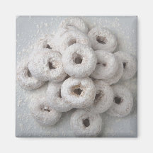 Close-up of powdered doughnuts in a plate fridge magnet