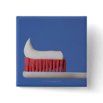 Close-up of toothpaste on a toothbrush pinback button
