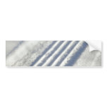 Close-up on a tyre traces in the snow bumper stickers