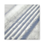 Close-up on a tyre traces in the snow magnets
