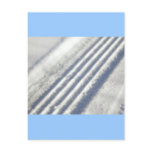 Close-up on a tyre traces in the snow postcards