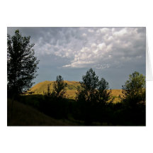 Clouds over mountains in summer evening greeting cards