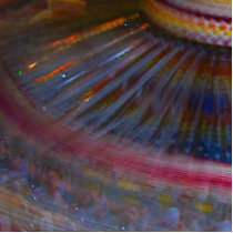 Colourful night fair ride action spinning shot