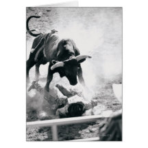 Cowboy on ground after falling off bull card
