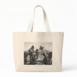 Cowboys looking a magazine tote bags