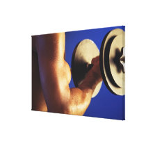 Cropped shot of man lifting weights stretched canvas prints