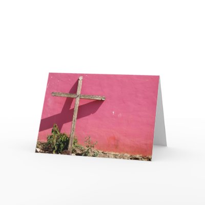 cross leaning on pink wall cards by camerabag