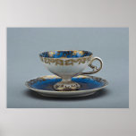 Cup and saucer with colourful designs posters