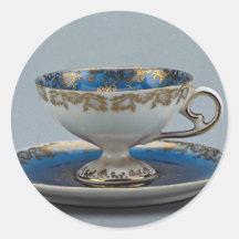 Cup and saucer with colourful designs round sticker