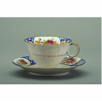 Cup and saucer with colourful flower designs on it acrylic cut outs