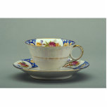 Cup and saucer with colourful flower designs on it photo sculptures