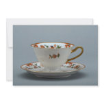 Cup and saucer with colourful flowers on it. invitations