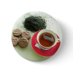 Cup of black tea with chocolate biscuits buttons
