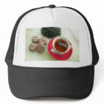 Cup of black tea with chocolate biscuits hats