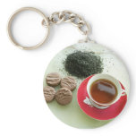 Cup of black tea with chocolate biscuits keychains