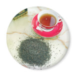 Cup of black tea with chocolate biscuits magnets