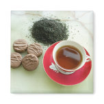 Cup of black tea with chocolate biscuits magnets