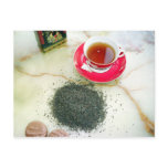 Cup of black tea with chocolate biscuits postcards