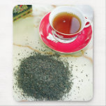 Cup of black tea with tea leaves mouse pad