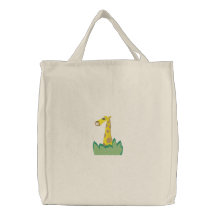 cute giraffe in bushes tote bag