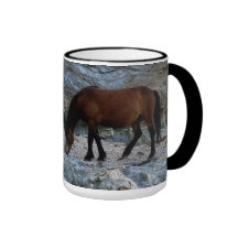 Dartmoor pony in rocks on remote south Devon beach Coffee Mug