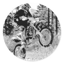 Dirt bike wheeling in the woods round sticker